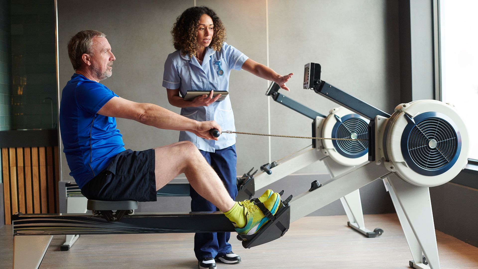 A Male adult on a therapy training session with a Therapist.